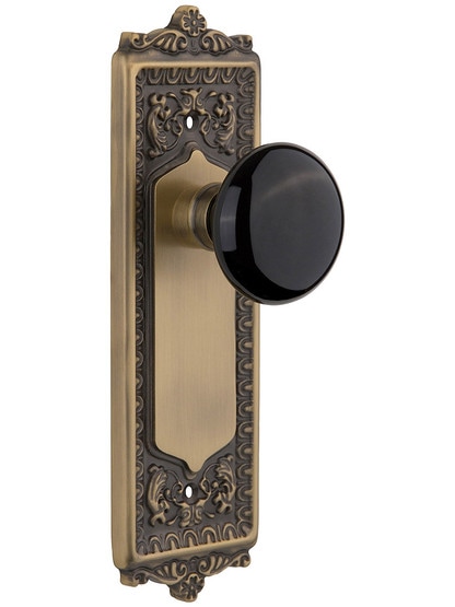 Egg and Dart Plate with Black Porcelain Knob without Keyhole in Antique Brass with .